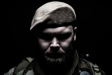 Close up portrait of bearded commando fighter, army special forces soldier, private military...
