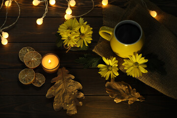 cup of coffee on the autumn background with leaves and flowers 