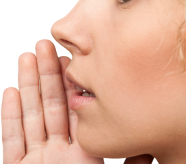 Close up portrait of a smiling skin care woman whispers (tells) a gossip.