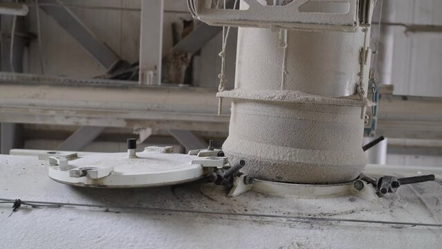 The grain is loaded into a tank truck. Loads dry cargo ship with grain. The grain is automatically loaded into the vehicle.