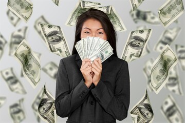 Cheerful happy woman with a lot of money
