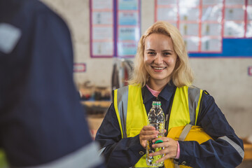 Cute young lady engineer staff happy smile. woman worker drinking water brake relax at workplace.
