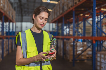 Relax engineer adult woman worker using smartphone at workplace