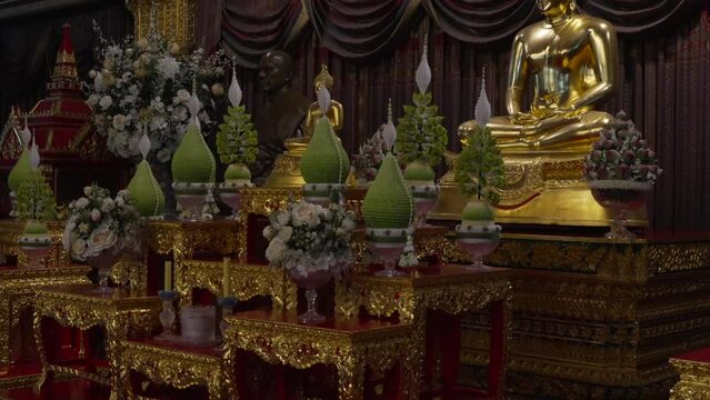 Buddha shrine at Wat Paknam Bhasicharoen Bangkok Thailand side tilt shot