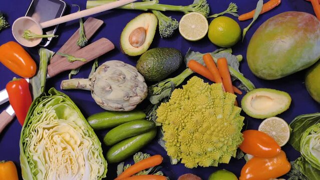 Close-up of vegetables on top of a table with a blue background