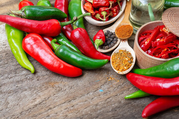 different seasonings for cooking, varieties of hot chilli pepper, ground pepper and spices, oil....