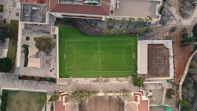 Overhead view of an empty football pitch in Malaga Spain in the midst of residential buildings  