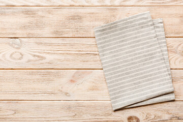top view with gray kitchen napkin isolated on table background. Folded cloth for mockup with copy space, Flat lay. Minimal style