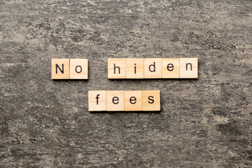 no hidden fees word written on wood block. no hidden fees text on table, concept