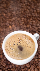 Cup of hot black coffee with froth.  Coffee with froth
