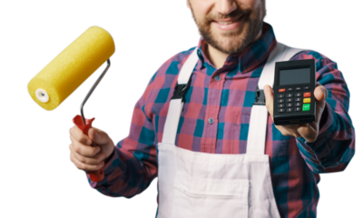 Professional painter holding a POS terminal