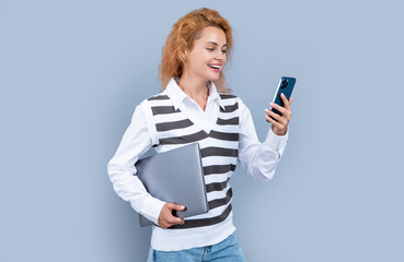 happy manager woman with device isolated on grey background. manager woman