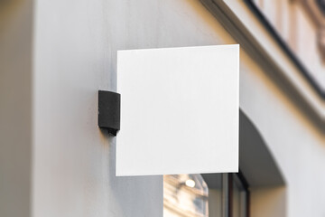 Blank square sign mockup in the urban environment, empty space to display your advertising or...