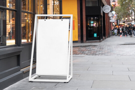 Blank A board sign mockup in the urban environment, empty space to display your advertising or branding campaign