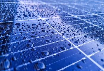 water drops on glass surface of a photovoltaic solar panel