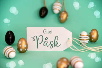 Fototapeta na wymiar Golden Easter Egg Decoration. Label With Glad Pask Means Happy Easter