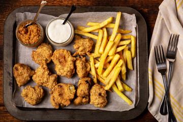 Cauliflower wings food. Cauliflower pieces and french fries with vegan sauces. Vegetarian food.