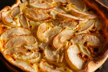 Pie with apples close-up. Sliced baked in apple dough. Food background.