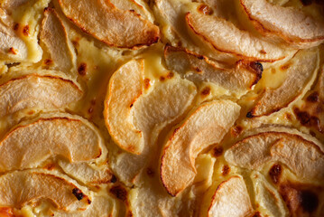 Pie with apples close-up. Sliced baked in apple dough. Food background.