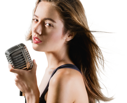 Beautiful young female singer with vintage microphone