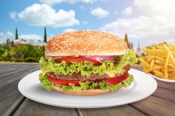 Tasty fresh fast food Burger on the desk