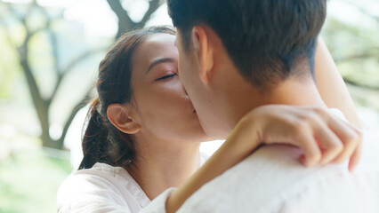 Young adult asia people fiance happy lover flirt fall in love nose lips kiss hug cuddle care trust....