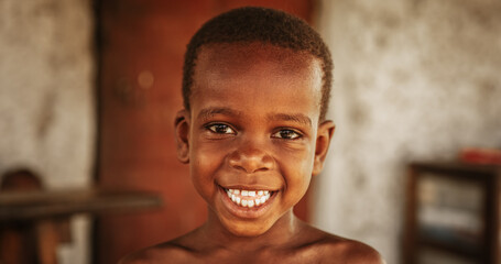 Close up portrait of a Cute Little African Kid with a Big Beautiful Smile Looking at the Camera....