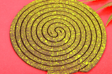 Mosquito coil is mosquito-repelling incense, made by (Azadirachta indica), neem leaves, usually shaped into a spiral, Anti mosquito, green color - insecticides. with neem leaves isolated