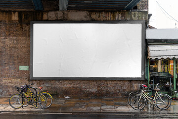 Blank billboard sign mockup in the urban environment, on the facade, empty space to display your advertising or branding campaign - obrazy, fototapety, plakaty