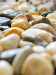 A vertical image of an assortment of colorful rocks.