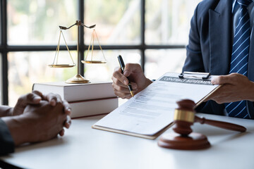 Law concept. Asian young lawyer or legal advisor explaining details Business contract agreement...