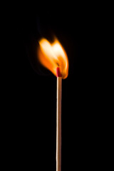 Lighting matches at the moment when it explodes. Burning match on black background. 