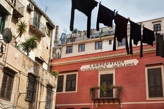 Line full of black hanging clothes in the Kalsa quarter of Palermo, Sicily