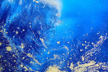 Fototapeta na wymiar Luxury abstract background, liquid art. Blue alcohol ink with golden paint streaks, water surface, marble texture