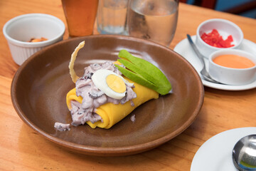 Causa de pulpo octopus Sea food ceviche Assorted food plates Peru traditional comfort food buffet table