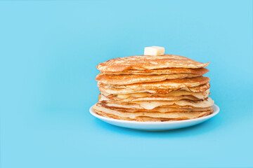 Staple of yeast fluffy pancakes with butter. Spring holiday Traditional Russian Shrovetide...