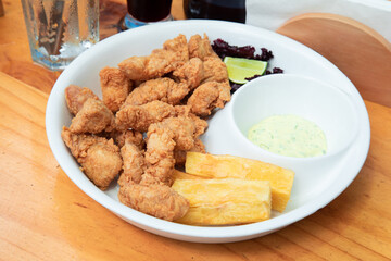 Chicharrón de pota pescado fish sticks Sea food ceviche Assorted food plates Peru traditional comfort food buffet table