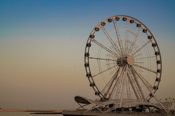 ferris wheel on the sunset sky