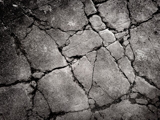 In the eerie black and white landscape, the concrete is riddled with many cracks. Double exposure creative hologram.