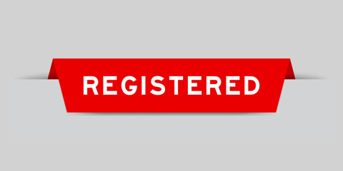 Red color inserted label with word registered on gray background