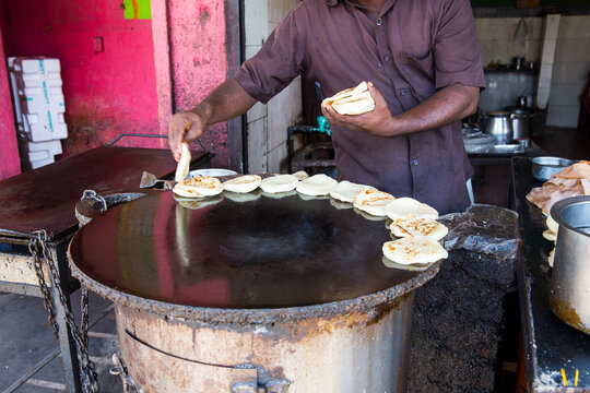 Man in restaurant doing parotta bread for lunch and dinner