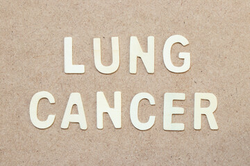 Wood alphabet letter in word lung cancer on wood background