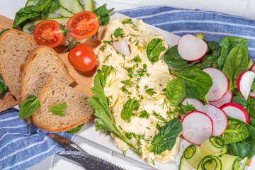  Homemade Trendy Butter Board, with fresh spring vegetables and grain bread slices