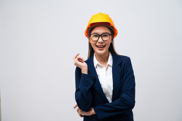 Portrait of Asian female engineer with hard hat isolated on grey background.