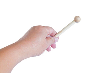 Hand holding a Woodenstick ,drumstick  on background.