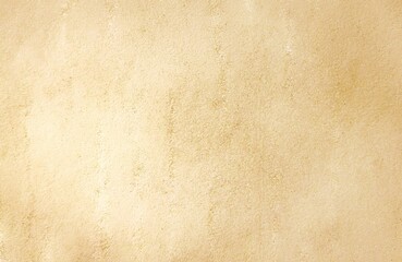 Abstract graphic design of a clay-plaster textured background or a blank canvas in beige-yellow tones.