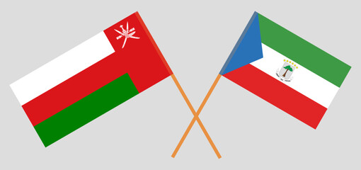 Crossed flags of Oman and Equatorial Guinea. Official colors. Correct proportion