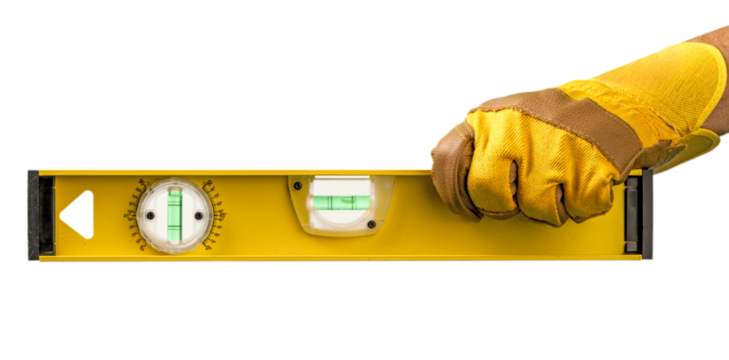 Yellow spirit level in workers hand isolated on white background.