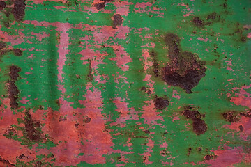 Grunge rusted metal texture, covered with old colored paint, rust and oxidized metal background....