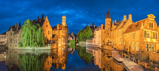 Bruges Belgium, night panorama city skyline at Rozenhoedkaai Dijver Canal with Belfry Tower
